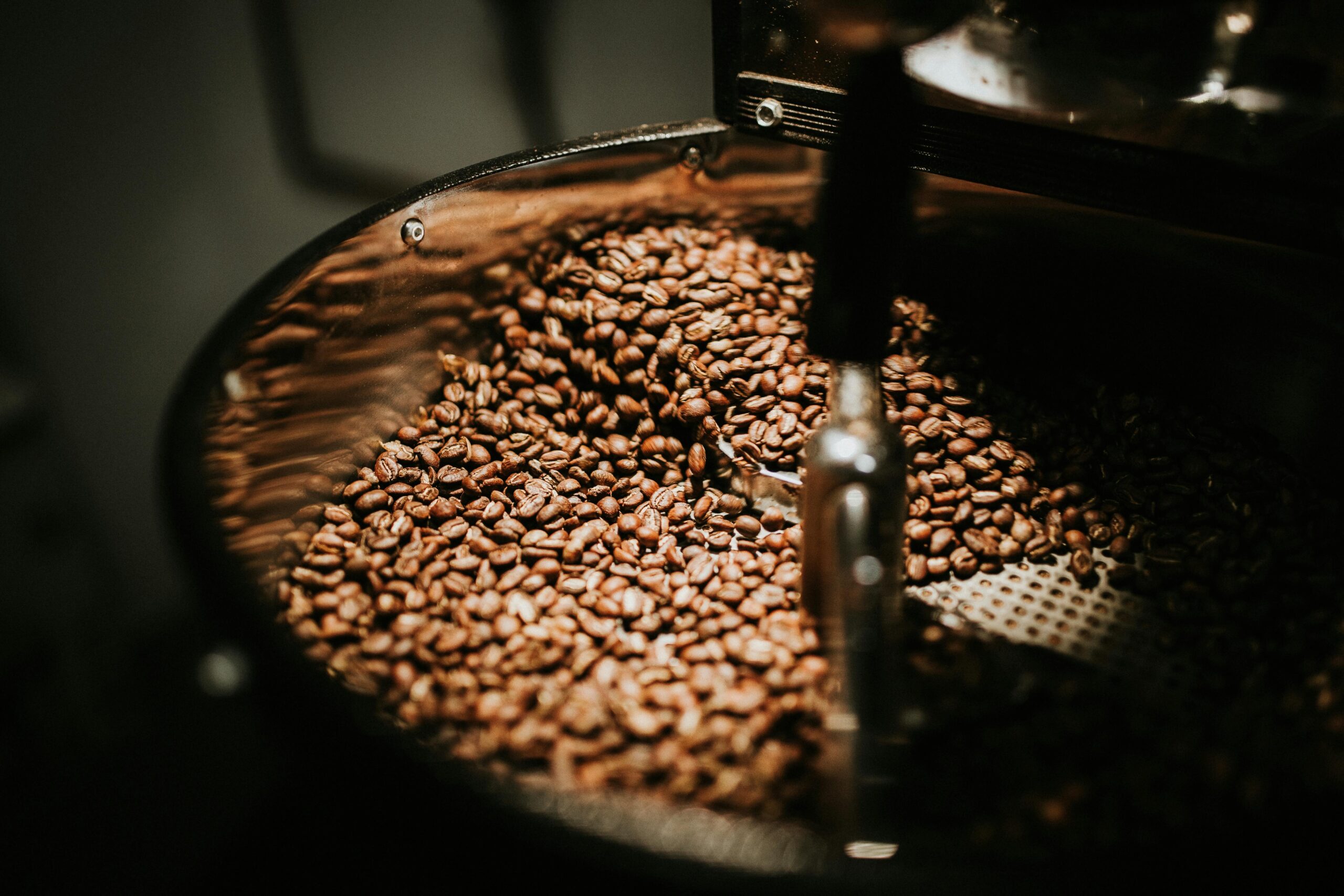 Coffee beans being stirred in a coffee roasting machines