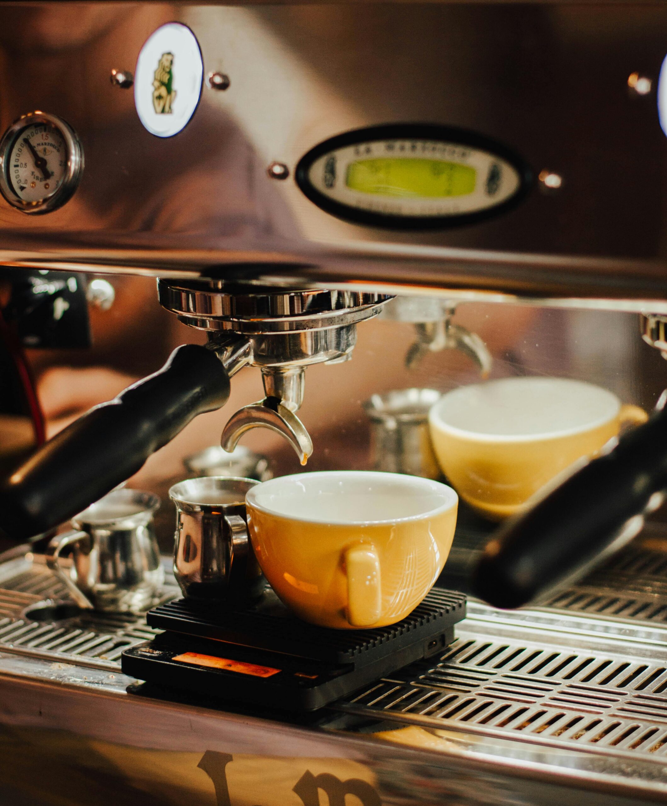 A La Marzocco espresso machine delivers espresso in two cups
